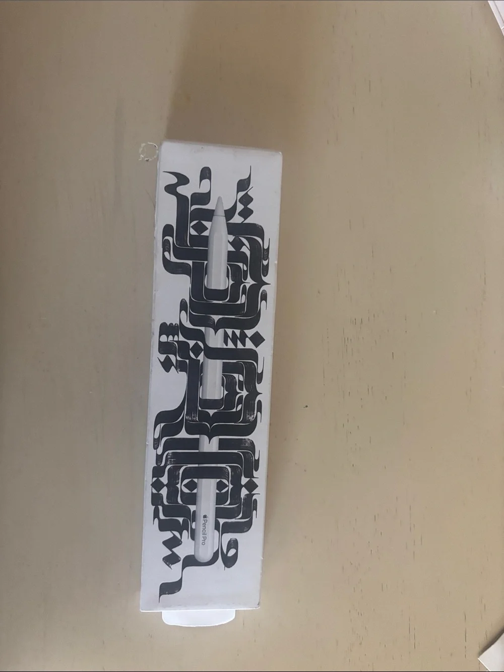 Apple Pencil with Black Graphic Sleeve on White Box